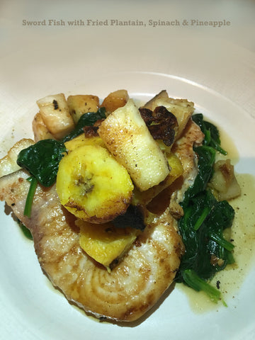 Swordfish with fried plantain & pineapple on a bed of spinach